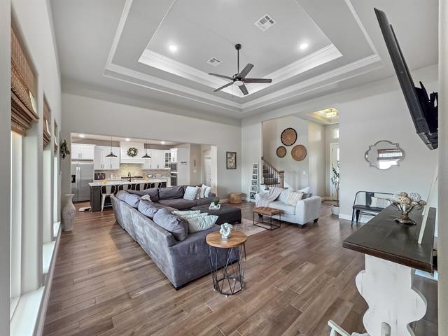 14845 Norma Jane Lane Beaumont, TX 77713 - Photo 6 of 35 a living room with fireplace furniture and a wooden floor