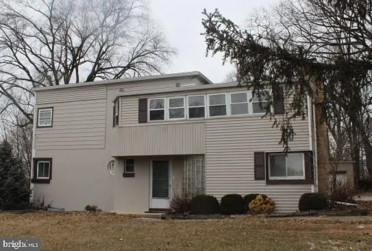 a front view of a house with yard