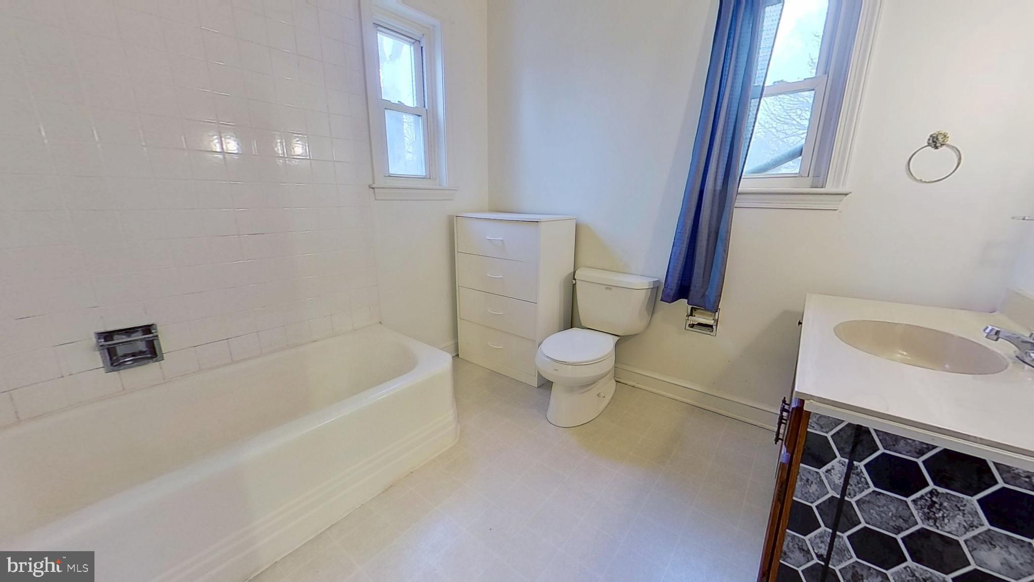 2821 South Queen Street Dallastown, PA 17313 - Photo 13 of 14 a bathroom with a sink toilet and shower