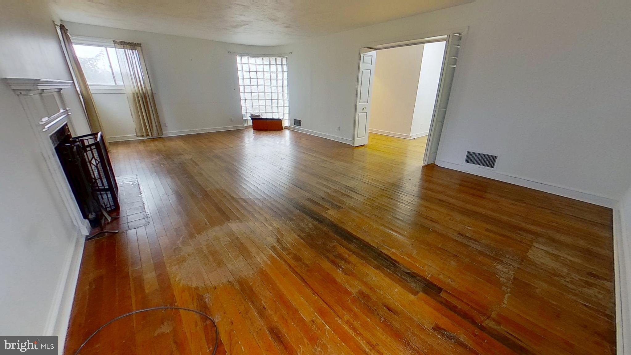2821 South Queen Street Dallastown, PA 17313 - Photo 2 of 14 a view of empty room with wooden floor and fan