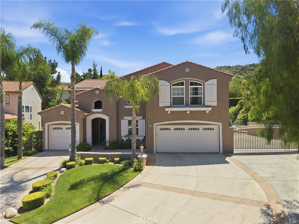 25120 Southwind Court Stevenson Ranch, CA 91381 - Photo 1 of 41 a front view of a house with garden