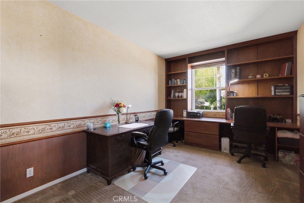 25120 Southwind Court Stevenson Ranch, CA 91381 - Photo 13 of 41 a view of a workspace with furniture and a window