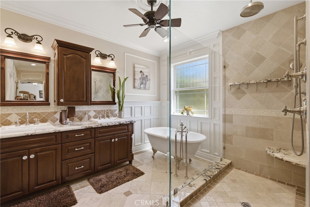 25120 Southwind Court Stevenson Ranch, CA 91381 - Photo 19 of 41 a spacious bathroom with a granite countertop sink mirror and shower