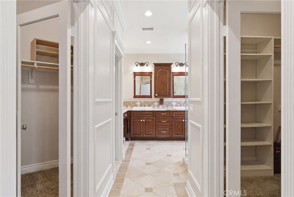 25120 Southwind Court Stevenson Ranch, CA 91381 - Photo 22 of 41 a bathroom with a bathtub shower sink and mirror