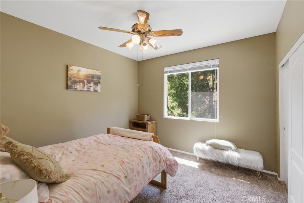 25120 Southwind Court Stevenson Ranch, CA 91381 - Photo 23 of 41 a bedroom with a bed and a window