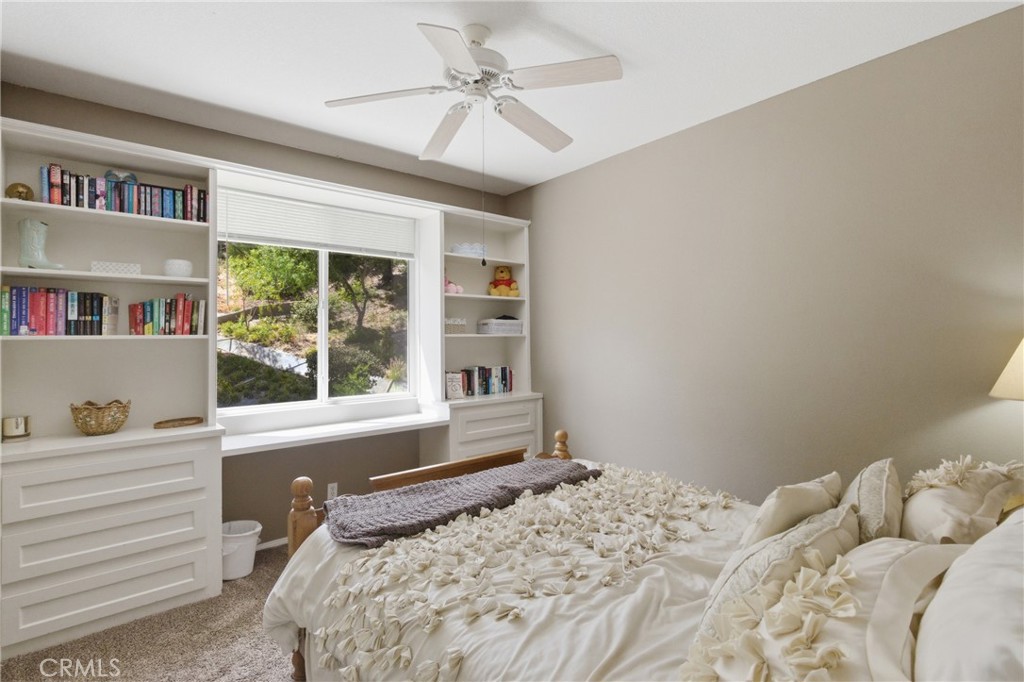 25120 Southwind Court Stevenson Ranch, CA 91381 - Photo 24 of 41 a bedroom with a large bed and a window