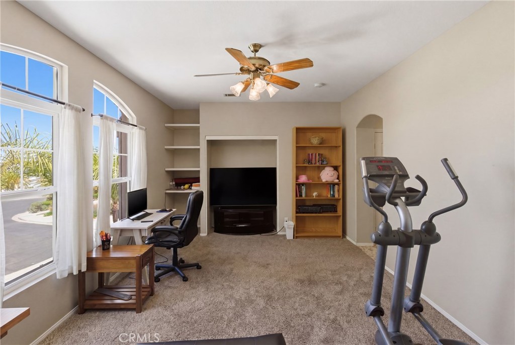25120 Southwind Court Stevenson Ranch, CA 91381 - Photo 26 of 41 a view of a workspace with furniture and a window