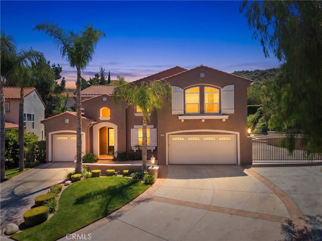 25120 Southwind Court Stevenson Ranch, CA 91381 - Photo 40 of 41 a front view of a house with a yard