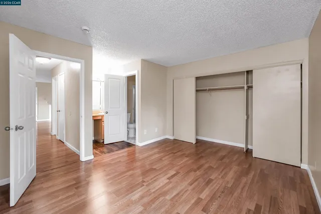 a view of hallway with wooden floor