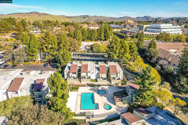 an aerial view of residential houses with outdoor space