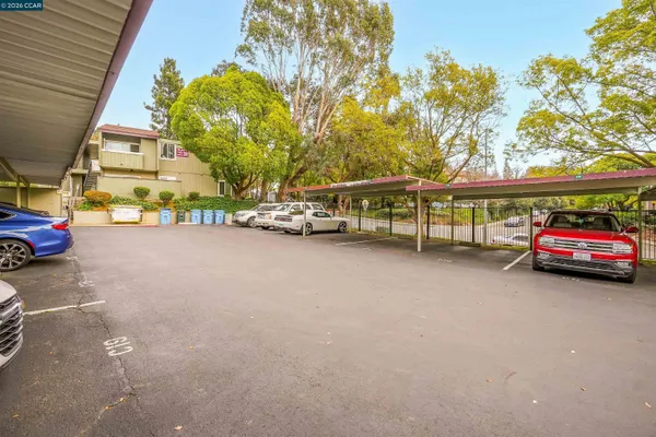 a view of a cars park in front of a house