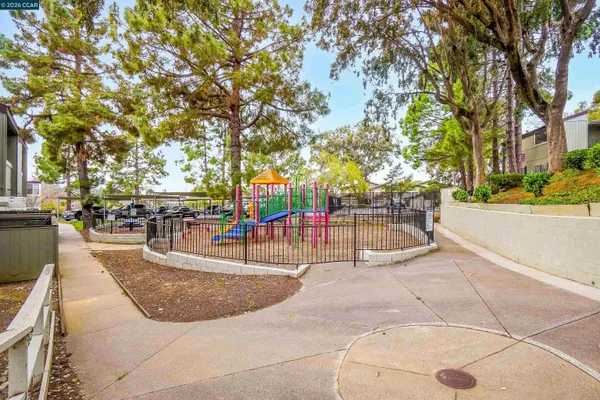 a view of a swimming pool with an outdoor seating