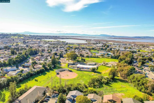 an aerial view of residential houses with outdoor space