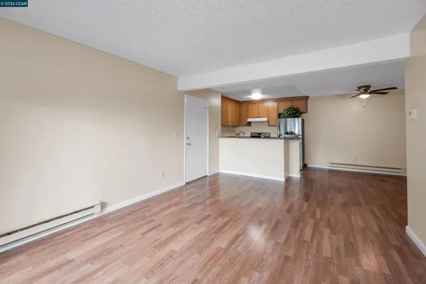 a view of a kitchen with wooden floor
