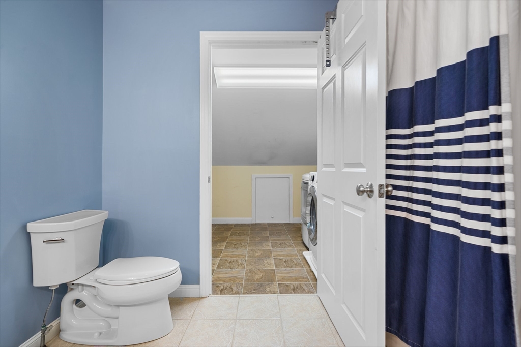 170 Beach Road, Unit 40 Salisbury, MA 01952 - Photo 17 of 32 a bathroom with a toilet and a shower