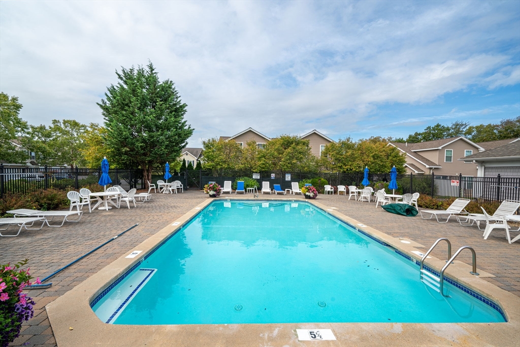170 Beach Road, Unit 40 Salisbury, MA 01952 - Photo 29 of 32 a view of a swimming pool and lounge chair