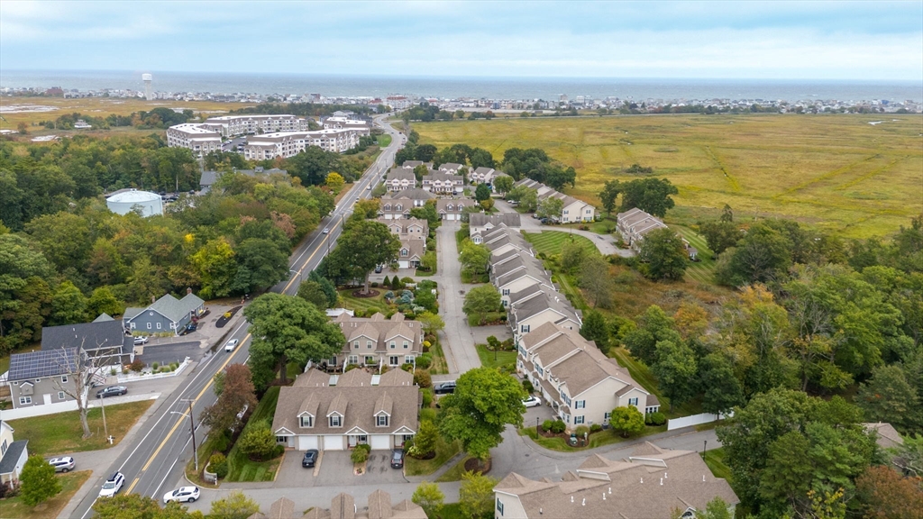 170 Beach Road, Unit 40 Salisbury, MA 01952 - Photo 3 of 32 an aerial view of residential building with outdoor space and ocean view