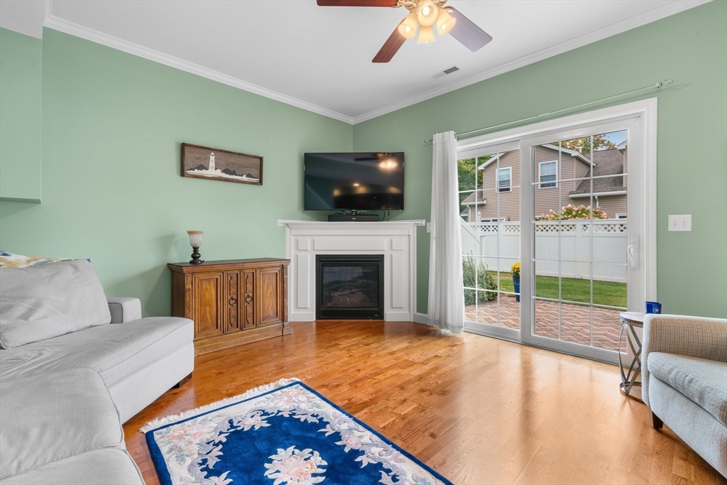 170 Beach Road, Unit 40 Salisbury, MA 01952 - Photo 5 of 32 a living room with furniture and a flat screen tv