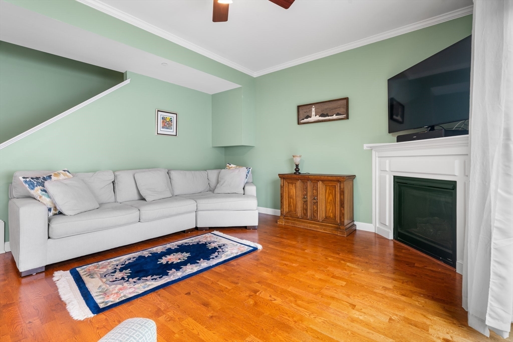 170 Beach Road, Unit 40 Salisbury, MA 01952 - Photo 6 of 32 a living room with a flat screen tv and a fireplace