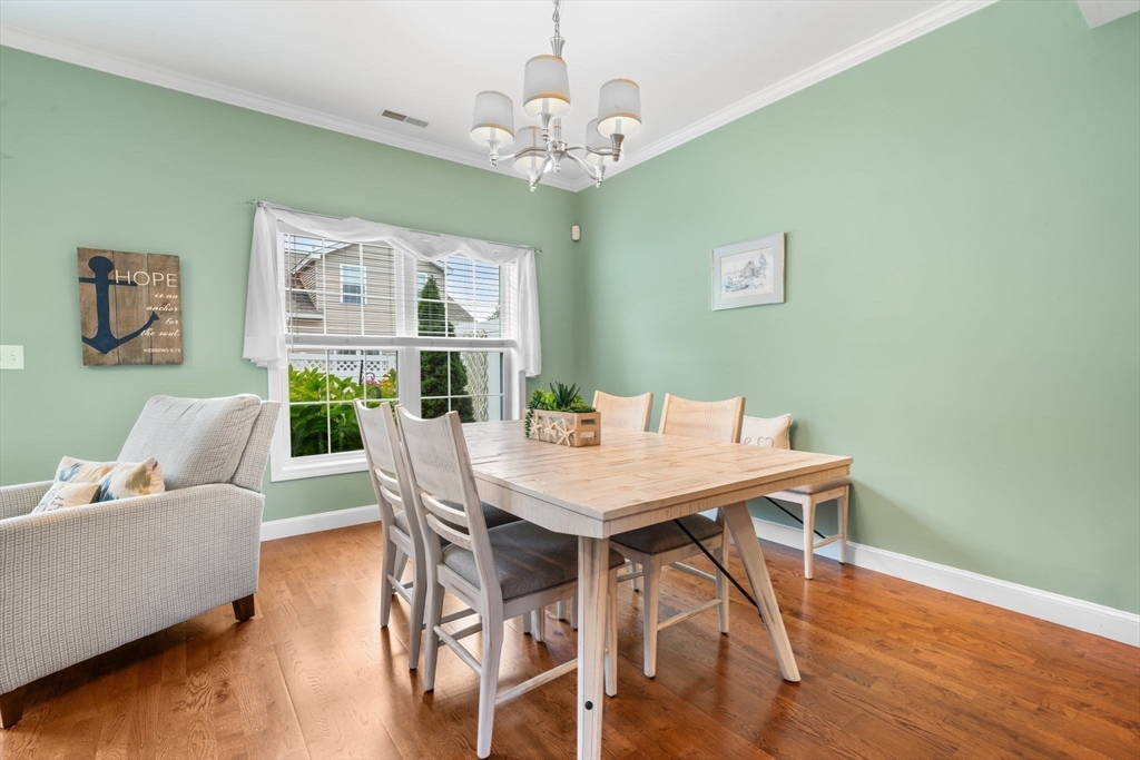 170 Beach Road, Unit 40 Salisbury, MA 01952 - Photo 10 of 32 a view of a dining room with furniture window and wooden floor