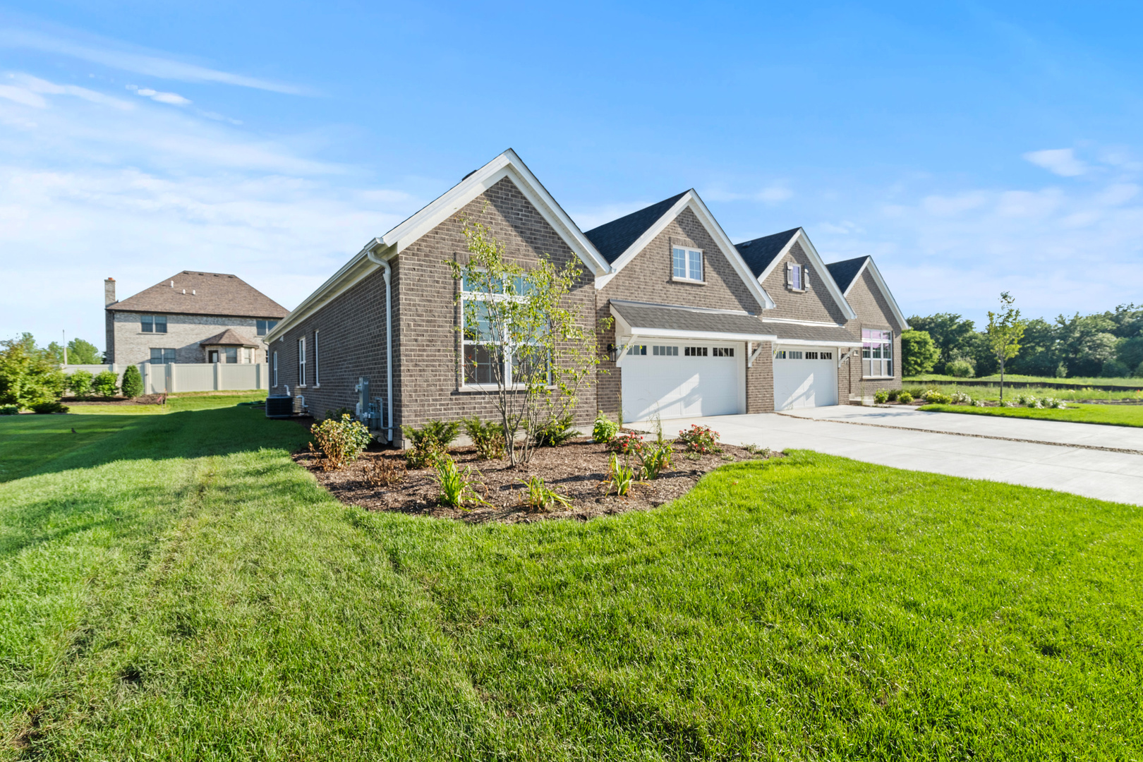 a view of a house with backyard sitting area and garden