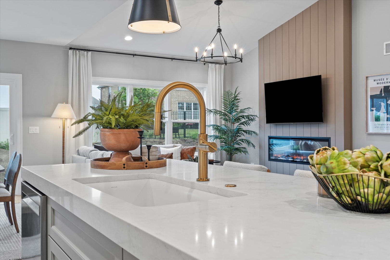 16580 Kayla Drive Lemont, IL 60439 - Photo 20 of 47 a living room with furniture a flat screen tv and a chandelier