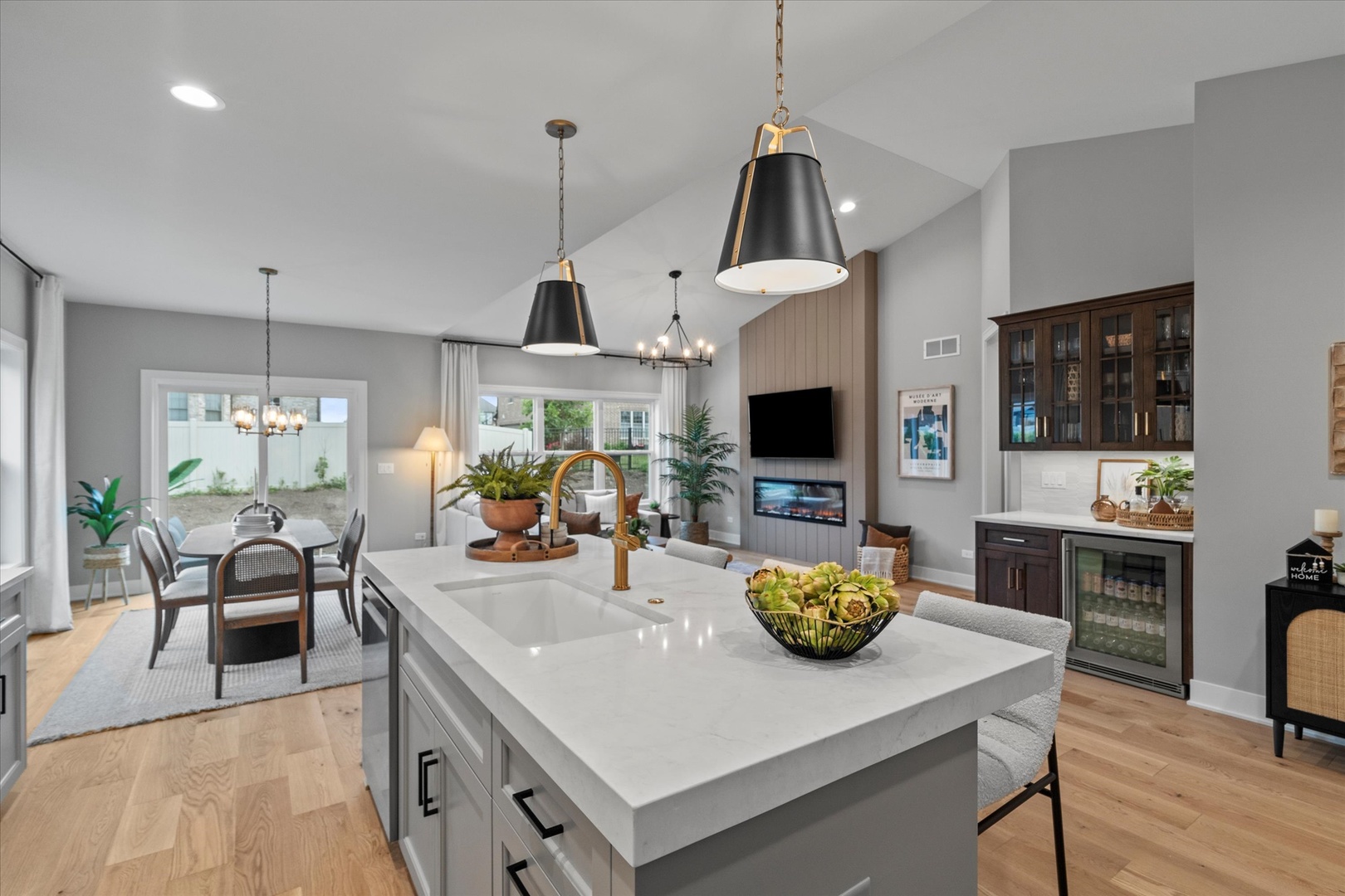 16580 Kayla Drive Lemont, IL 60439 - Photo 21 of 47 a kitchen with stainless steel appliances granite countertop a sink a stove and chairs with wooden floor