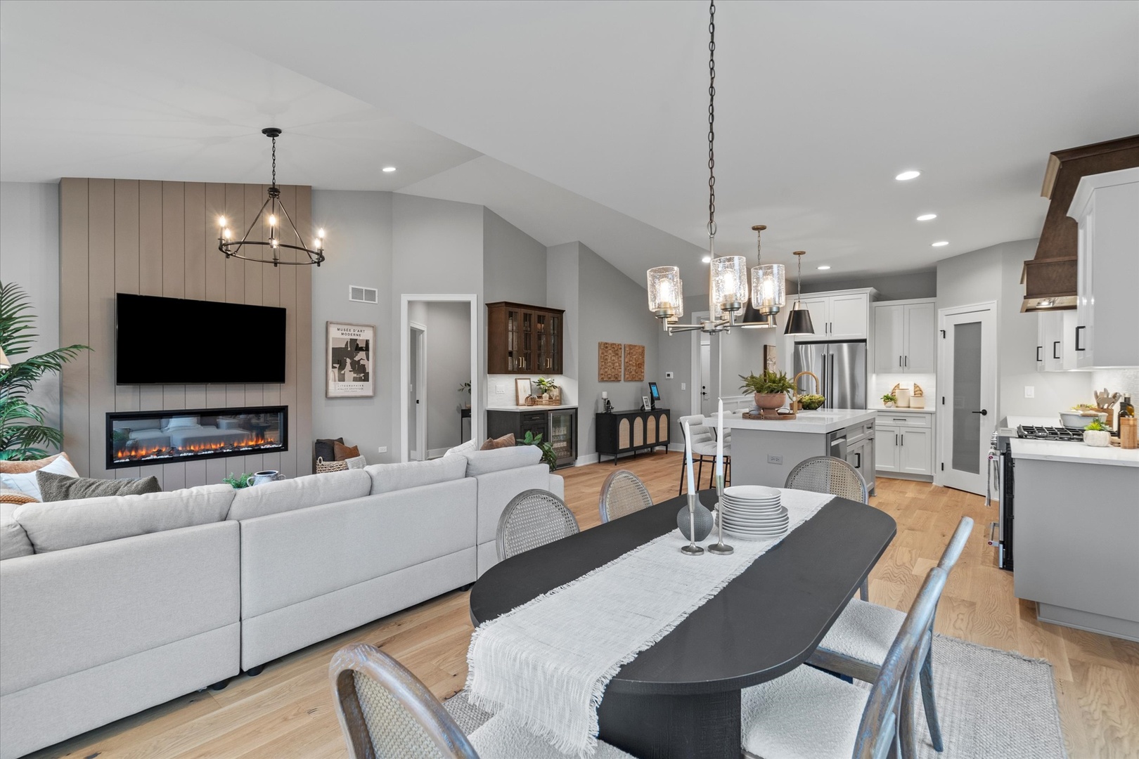 16580 Kayla Drive Lemont, IL 60439 - Photo 25 of 47 a living room with furniture a flat screen tv and kitchen view