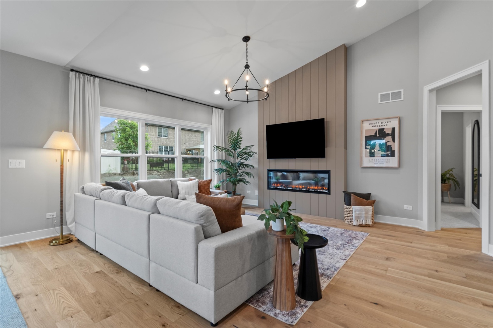 16580 Kayla Drive Lemont, IL 60439 - Photo 27 of 47 a living room with furniture and a flat screen tv