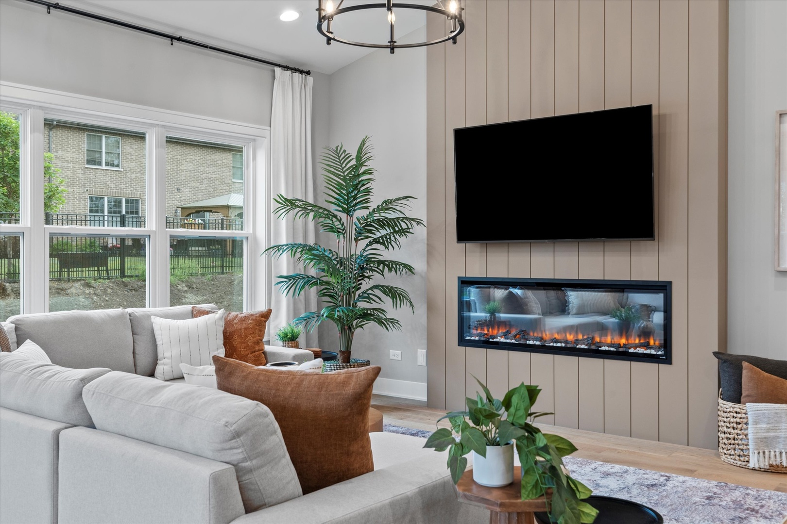 16580 Kayla Drive Lemont, IL 60439 - Photo 28 of 47 a living room with furniture and a flat screen tv