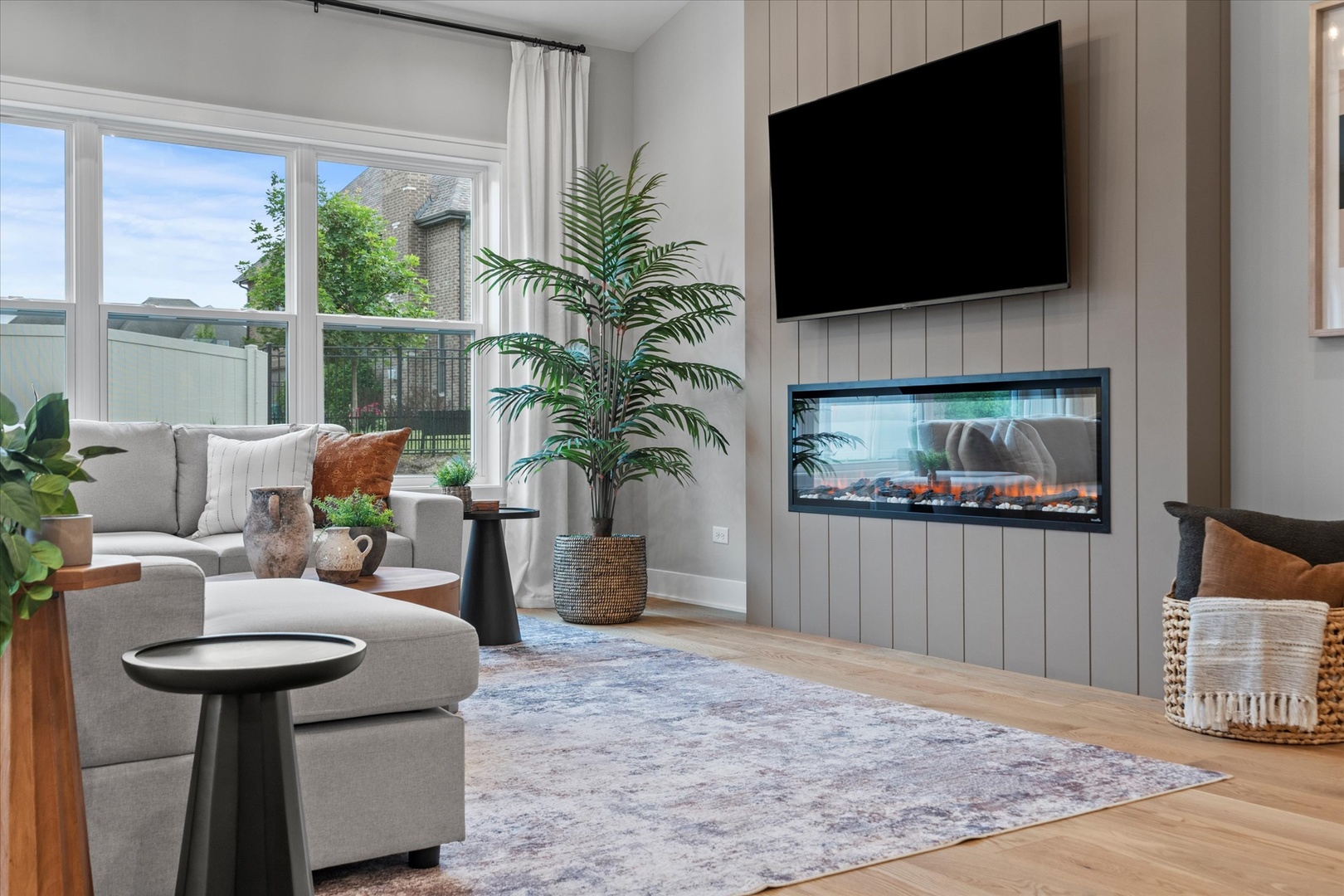 16580 Kayla Drive Lemont, IL 60439 - Photo 30 of 47 a living room with furniture and a flat screen tv