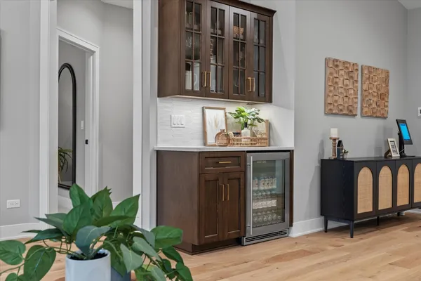 a kitchen with stainless steel appliances a counter space and wooden floor