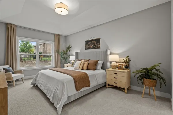 a bed room with a bed and a plant