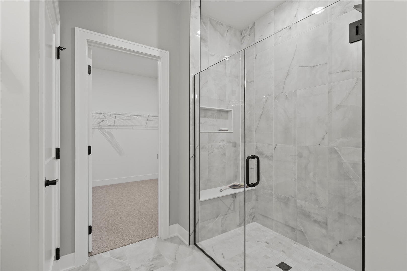16580 Kayla Drive Lemont, IL 60439 - Photo 40 of 47 a bathroom with a glass shower door