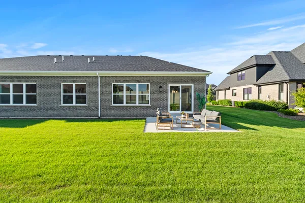 a view of a house with backyard porch and patio