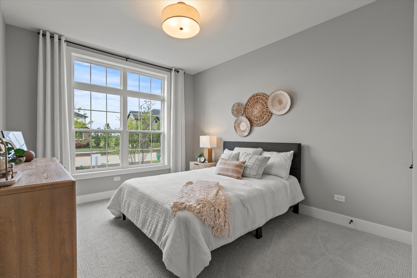 16580 Kayla Drive Lemont, IL 60439 - Photo 41 of 47 a bedroom with a large bed and a large window