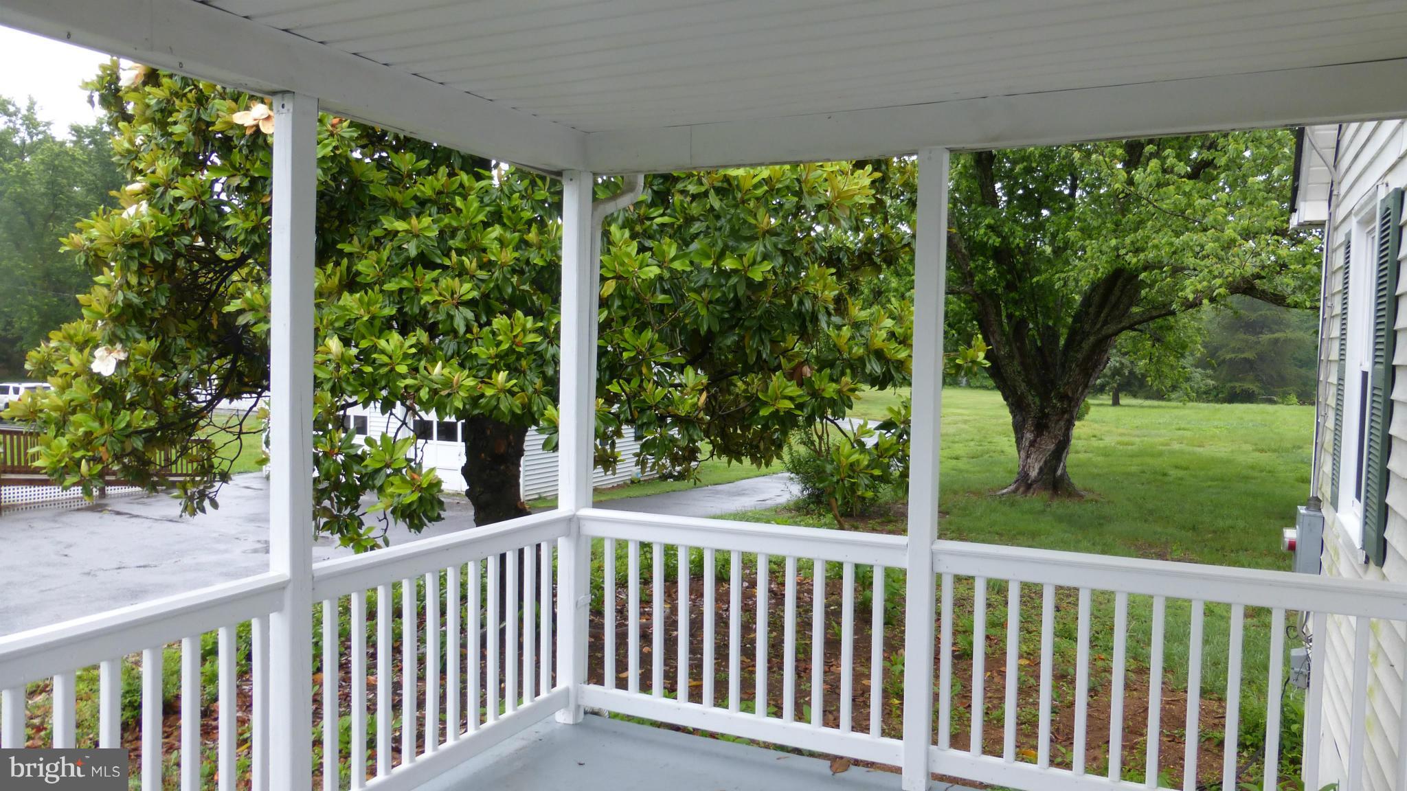 1431 Warrenton Road Fredericksburg, VA 22406 - Photo 2 of 25 a view of a porch with a yard