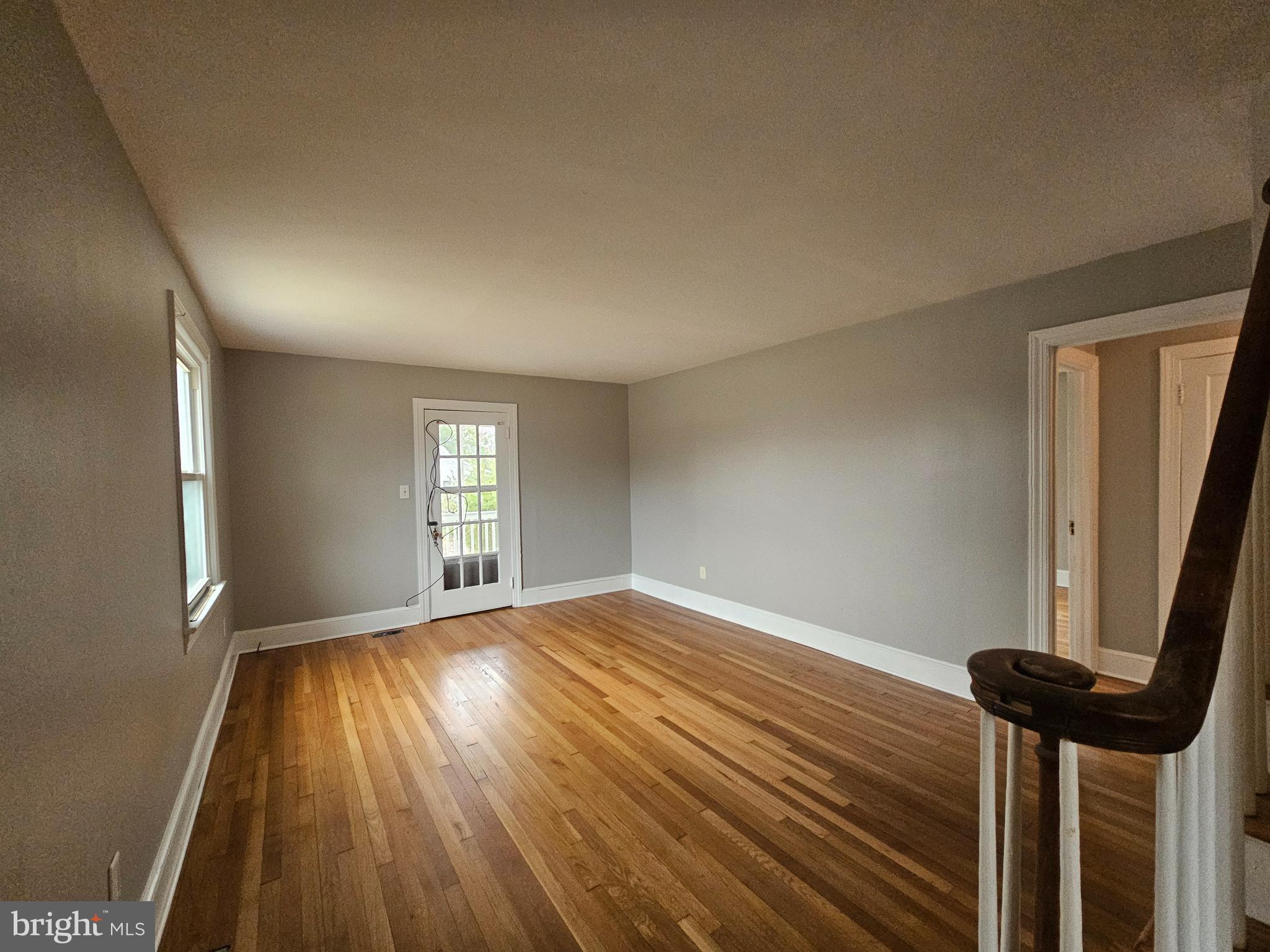 1431 Warrenton Road Fredericksburg, VA 22406 - Photo 3 of 25 a view of empty room with wooden floor and fan