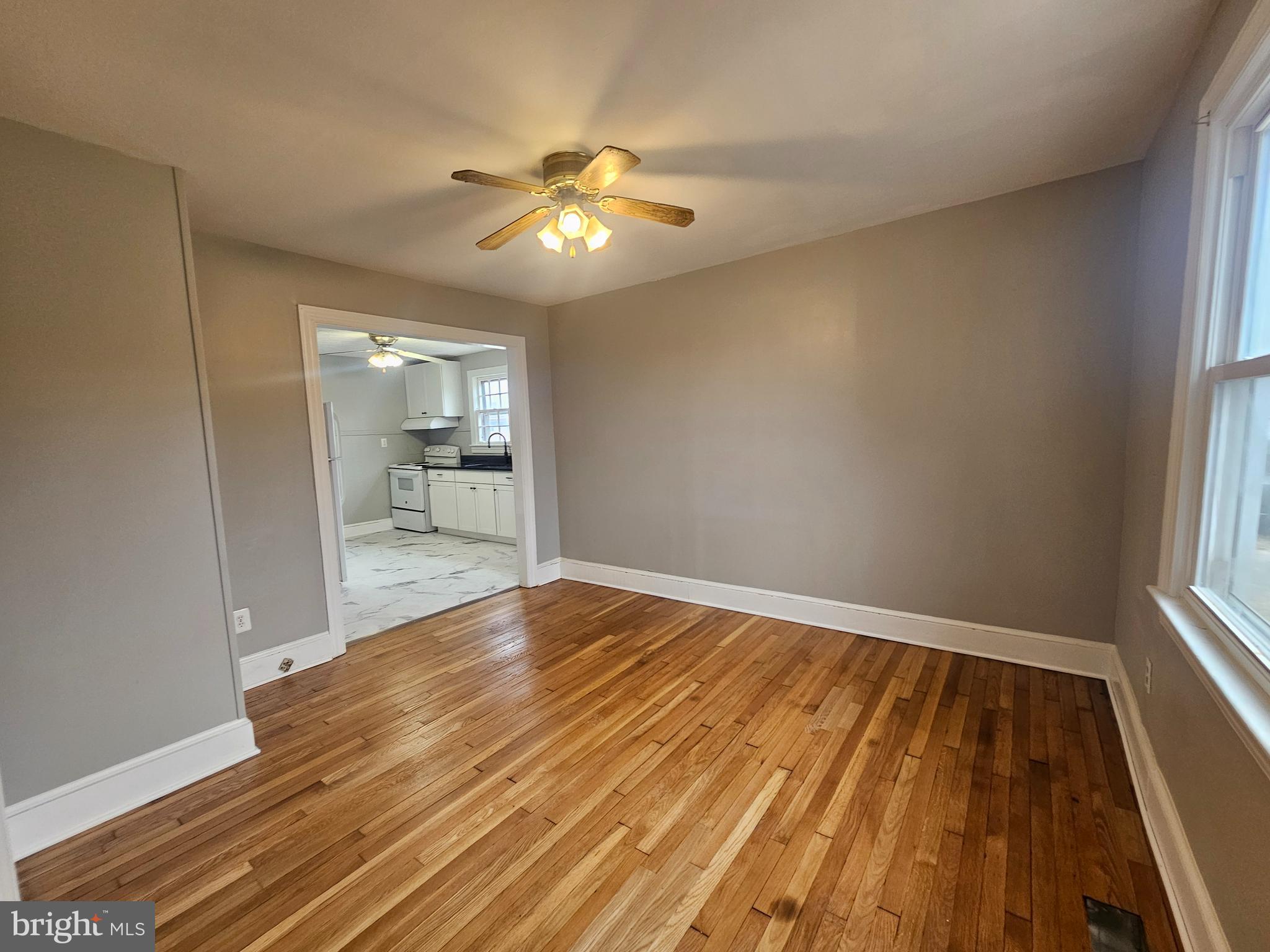 1431 Warrenton Road Fredericksburg, VA 22406 - Photo 5 of 25 wooden floor in an empty room with a window