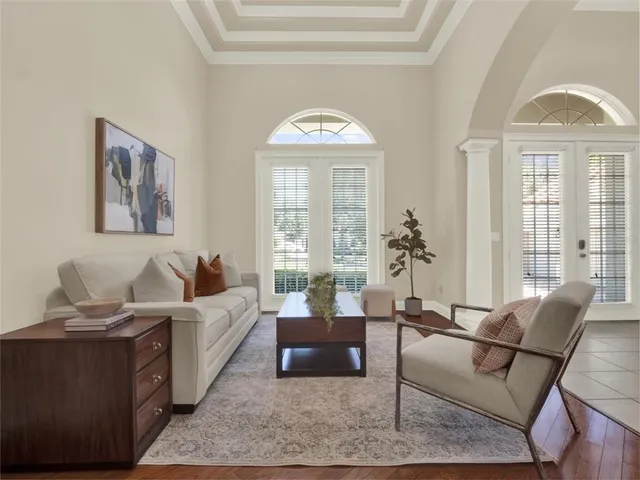 a view of a dining room with furniture and chandelier