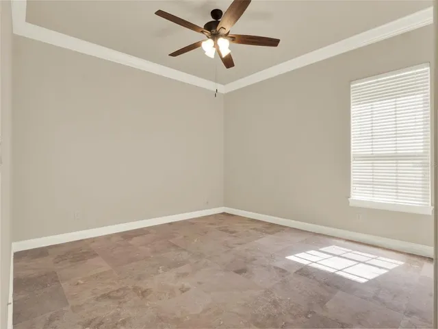 a spacious bathroom with a tub sink and mirror