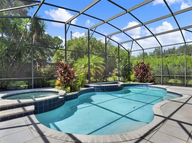 a view of a swimming pool with a porch
