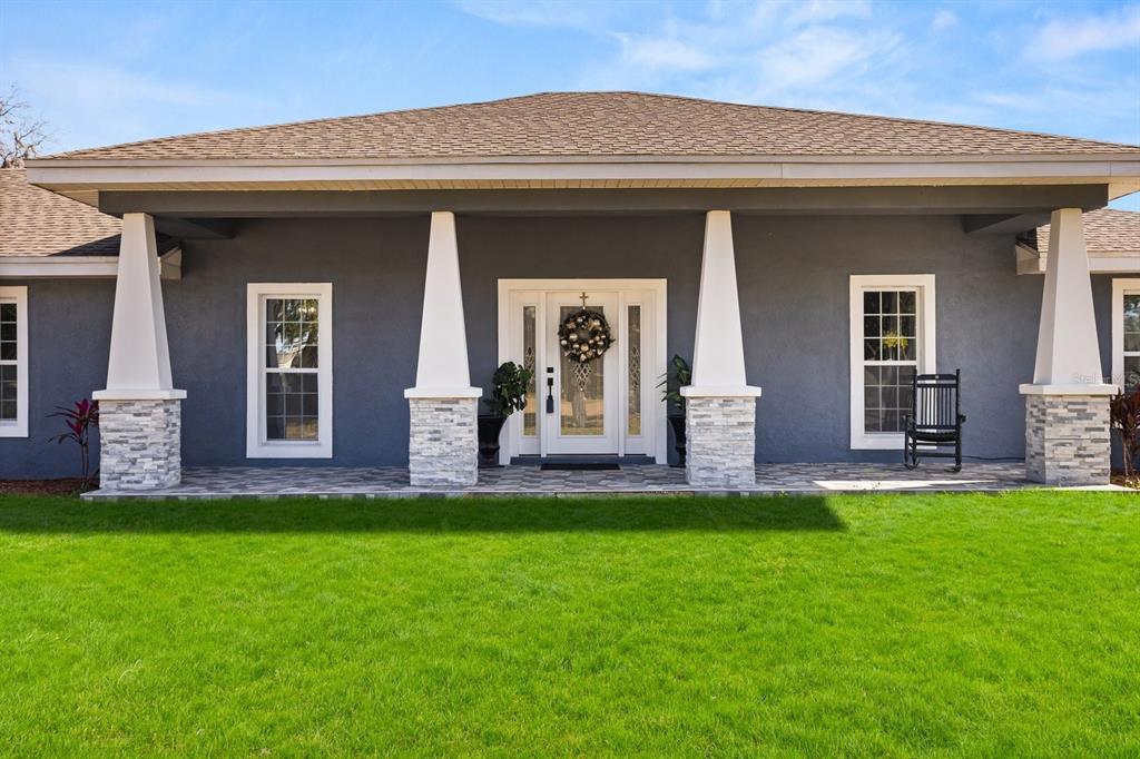 812 Chastain Road Seffner, FL 33584 - Photo 2 of 26 a front view of a house with a yard