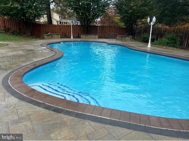 12614 Oxon Road Herndon, VA 20171 - Photo 8 of 71 a view of swimming pool with a patio