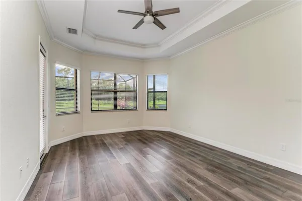 a bathroom with a double vanity sink and a tub