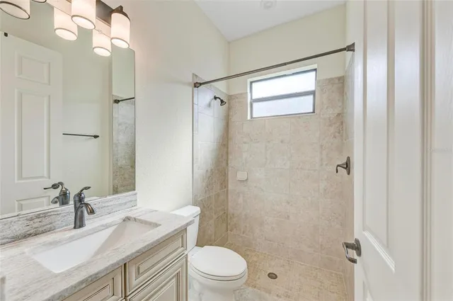 a view of a kitchen with a sink and cabinets