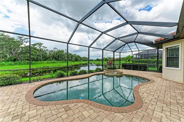 a view of a swimming pool with a porch