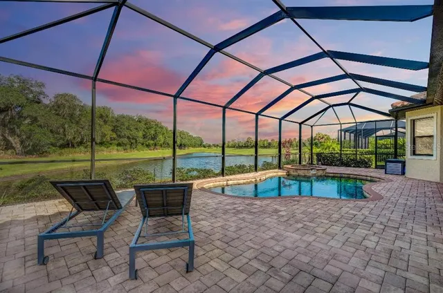 a view of outdoor space with swimming pool and furniture
