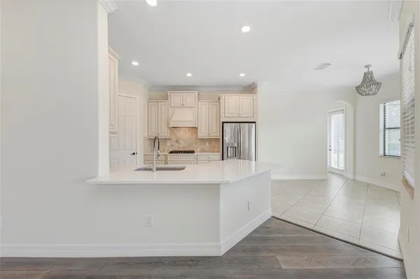 a kitchen with a sink cabinets and window