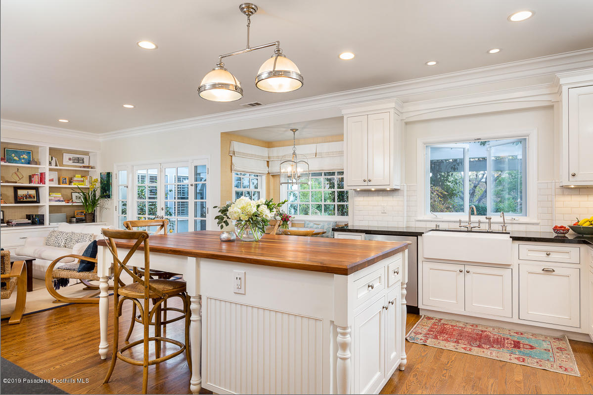 191 Sierra View Road Pasadena, CA 91105 - Photo 12 of 52 a kitchen with stainless steel appliances granite countertop a stove and a wooden floors